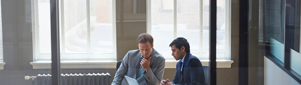 men talking at a table