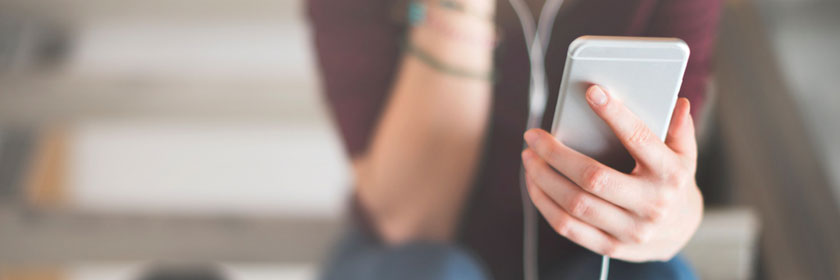 woman holding cell phone